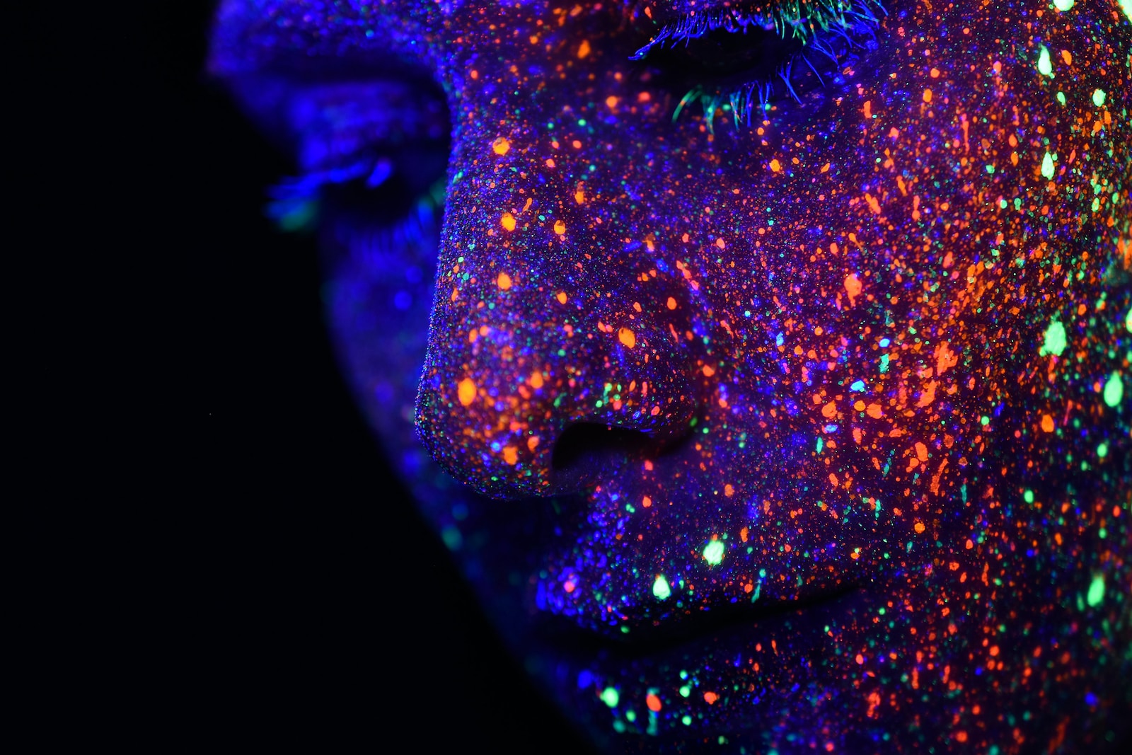 Photo by h heyerlein person with assorted-color paint on face
